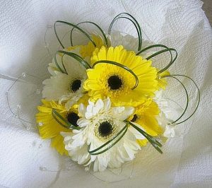 Wedding bouquet white white and yellow gerberas with bear grass