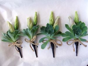 Succulent wedding buttons holes with twine bows